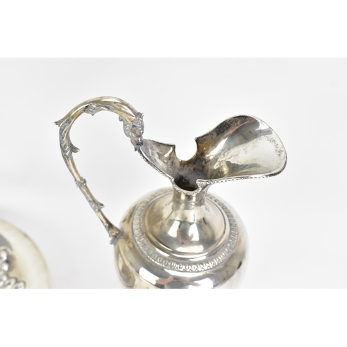 244 - An early 20th century continental white metal wine ewer and a tray, both stamped 900 KK, the ewer ha... 