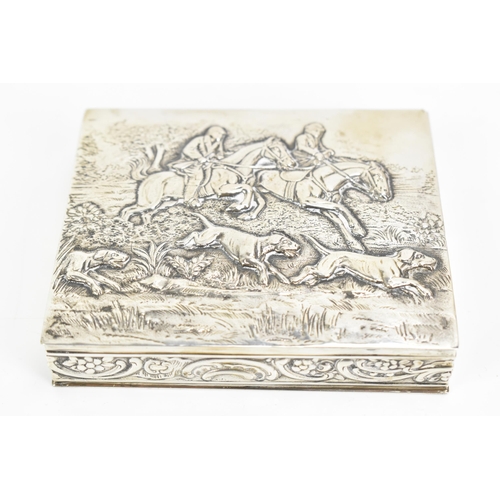 248 - A late 19th/early 20th century German 800 silver box, embossed with a hunting scene to the lid depic... 