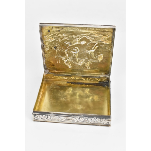 248 - A late 19th/early 20th century German 800 silver box, embossed with a hunting scene to the lid depic... 