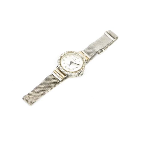 251 - A mid 20th century white metal ladies manual wind diamond cocktail watch, the silvered dial having A... 