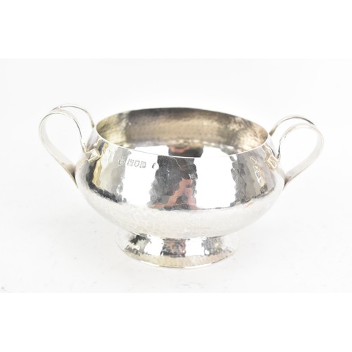 252 - An Edwardian silver Arts & Crafts bowl and spoon, by Stewart Dawson & Co Ltd, hallmarked London 1909... 