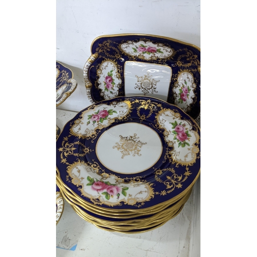 125 - An early 20th century Coalport porcelain, hand painted dessert service, on a cobalt blue ground and ... 