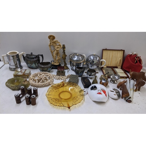 130 - A mixed lot to include a silver plated teaset, onyx table lighter, treen carved animals and other it... 