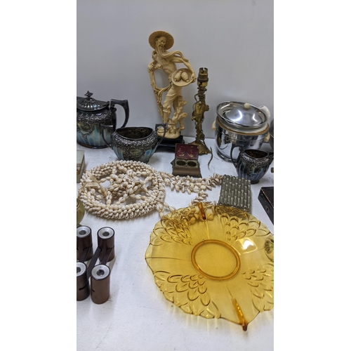 130 - A mixed lot to include a silver plated teaset, onyx table lighter, treen carved animals and other it... 