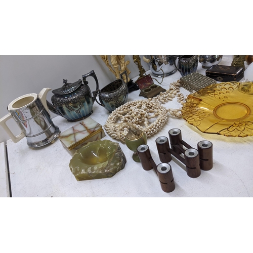 130 - A mixed lot to include a silver plated teaset, onyx table lighter, treen carved animals and other it... 