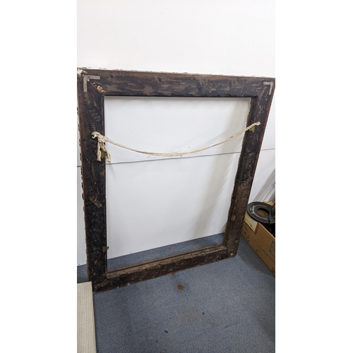 245 - A large Victorian gilt wood picture frame, moulded with acanthus leaves and applied balls, 120h x 10... 