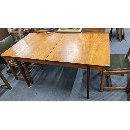 28 - A mid 20th century teak extending dining table, 72h x 152.5w, together with six early 20th century o... 