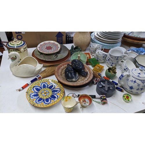 7 - A large mixed lot to include a Torquay biscuit barrel, African beaded objects, Sylvac ashtray, Deco ... 