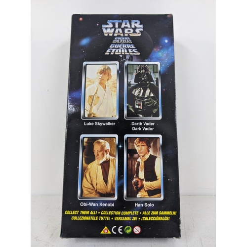 12 - Five collector series Star Wars figurines to include Darth Vader, Obi-Wan Kenobi, Han Solo, Luke Sky... 