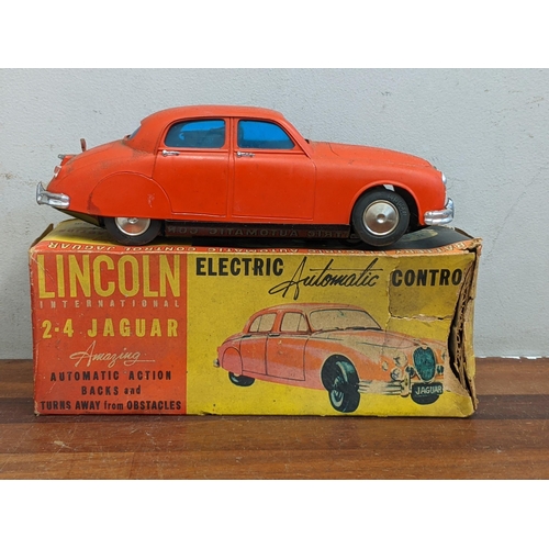 15 - A Lincoln International 2.4 Jaguar electric automatic control model boxed along with boxed models of... 