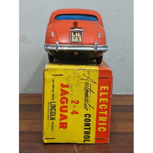 15 - A Lincoln International 2.4 Jaguar electric automatic control model boxed along with boxed models of... 