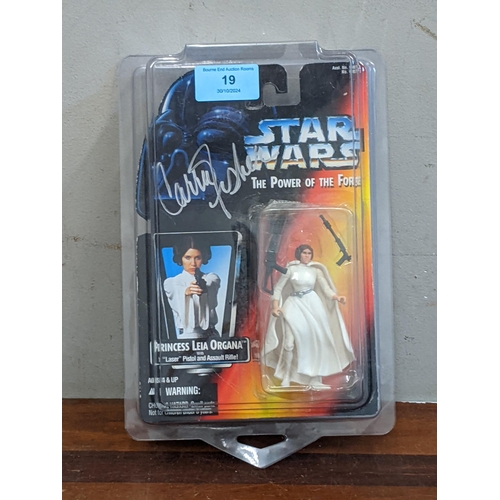 19 - A 1995 Kenner Star Wars Autographed The Power of The Force carded Princess Leia Organa action figure... 