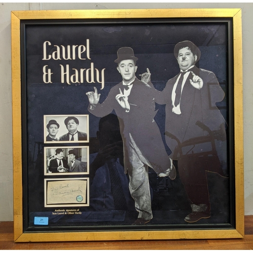 21 - A Laurel & Hardy framed signature cut with two photos and two signatures with a stamp GFA, comes wit... 