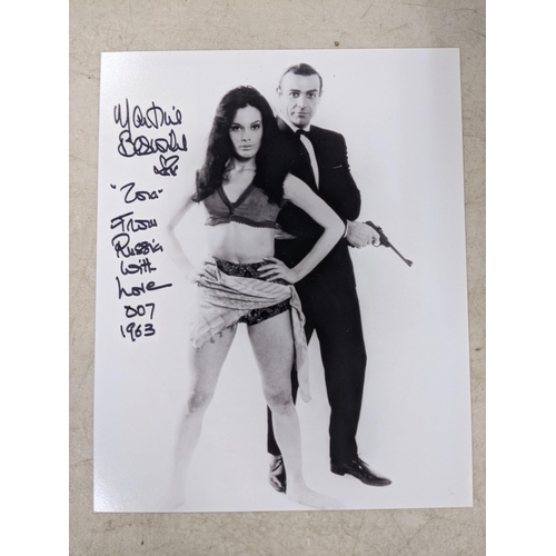 24 - Twelve signed James Bond related items to include a signed 10x8 photograph of Roger Moore and Fiona ... 