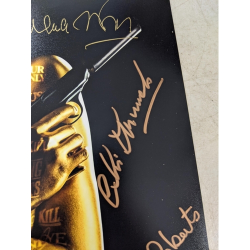 24 - Twelve signed James Bond related items to include a signed 10x8 photograph of Roger Moore and Fiona ... 