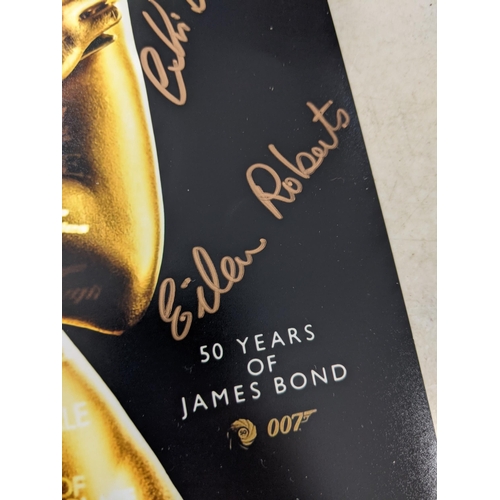 24 - Twelve signed James Bond related items to include a signed 10x8 photograph of Roger Moore and Fiona ... 