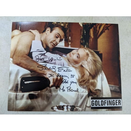 24 - Twelve signed James Bond related items to include a signed 10x8 photograph of Roger Moore and Fiona ... 