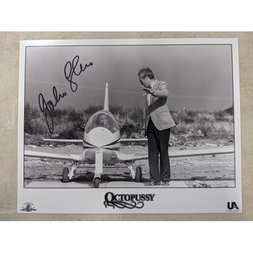 24 - Twelve signed James Bond related items to include a signed 10x8 photograph of Roger Moore and Fiona ... 