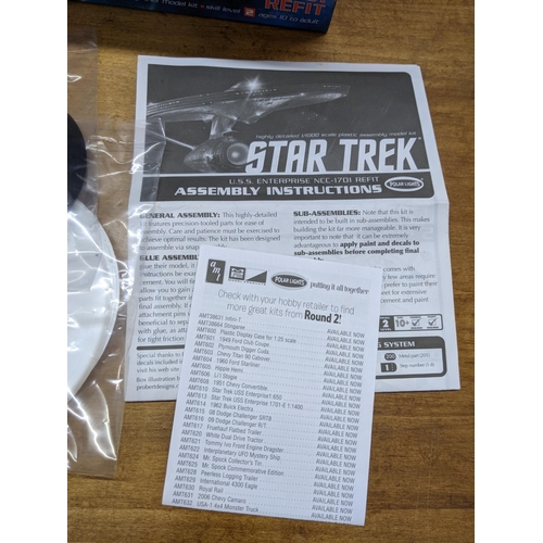 45 - Four Star Trek boxed spacecraft models to include Altamid Swarm Ship, USS Enterprise, USS Enterprise... 