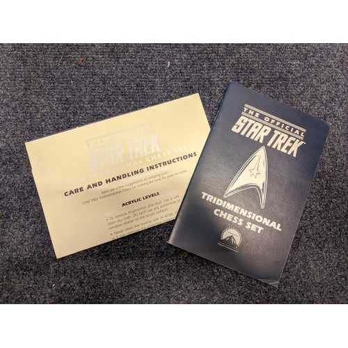 57 - An unused The Official Star Trek tridimensional chess set, the pieces are still sealed in the box wi... 