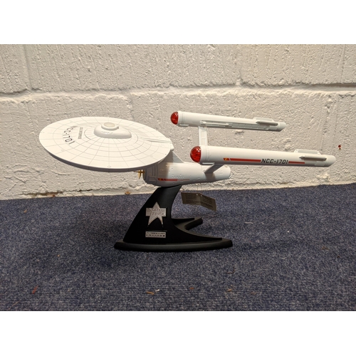 A Franklin Mint Star Trek USS Enterprise NCC-1701 25th Anniversary Edition diecast starship, with display stand
Location:
If there is no condition report shown, please request