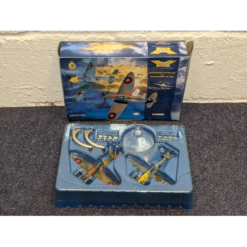 64 - Four boxed models of planes to include a 1990-2000 Battle of Britain commemorative model of a Hawker... 