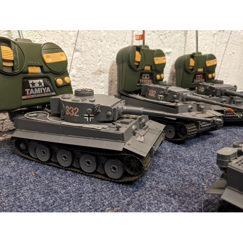 66 - Five Tamiya radio controlled model tanks to include three German tanks, one in camouflage livery
Loc... 