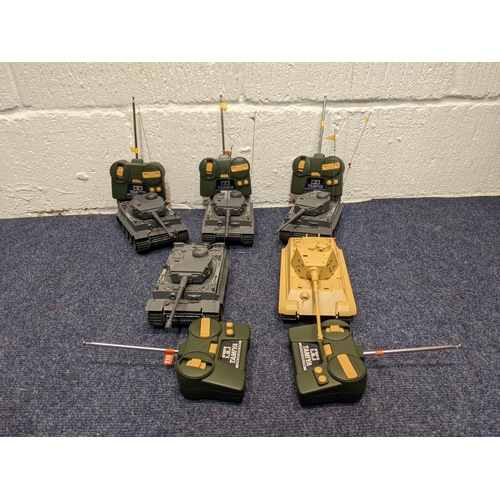 67 - Five Tamiya radio controlled model tanks to include four German tanks, one in desert camouflage live... 