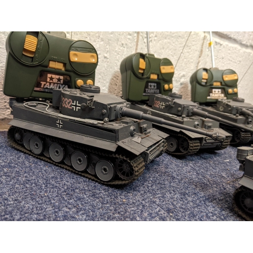 67 - Five Tamiya radio controlled model tanks to include four German tanks, one in desert camouflage live... 