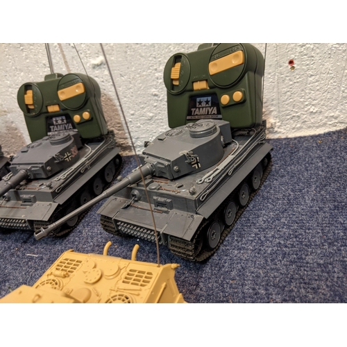 67 - Five Tamiya radio controlled model tanks to include four German tanks, one in desert camouflage live... 