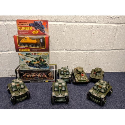 68 - Model tanks and armoured vehicles to include a tin plate tanks, a boxed Military Force King Tiger ta... 