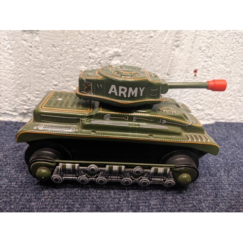 68 - Model tanks and armoured vehicles to include a tin plate tanks, a boxed Military Force King Tiger ta... 