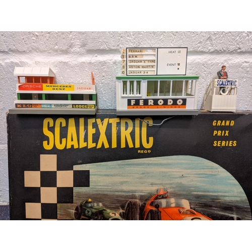 73 - Scalextric Grand Prix Series, boxed and other accessories to include sidecars, track, buildings, rac... 