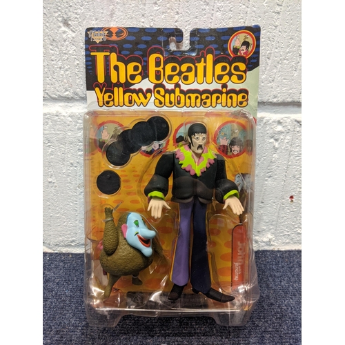 77 - Five McFarlane Toys, The Beatles Yellow Submarine figures to include Paul with Glove and Love Base, ... 