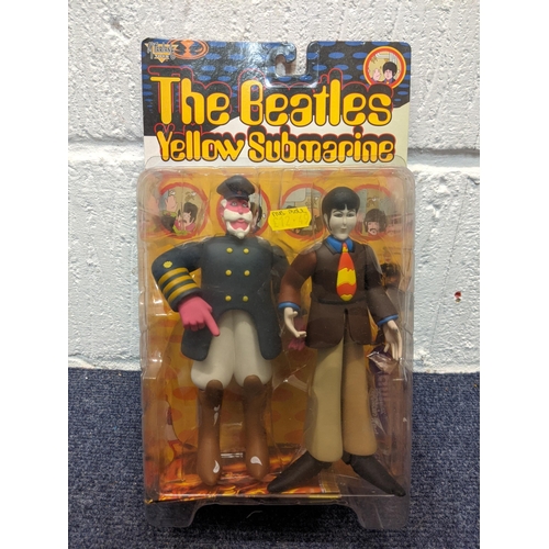 77 - Five McFarlane Toys, The Beatles Yellow Submarine figures to include Paul with Glove and Love Base, ... 