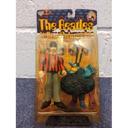 77 - Five McFarlane Toys, The Beatles Yellow Submarine figures to include Paul with Glove and Love Base, ... 