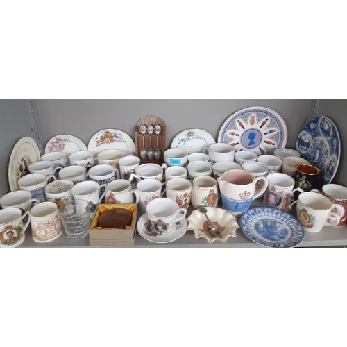 273 - A collection of commemorative china to include mugs, a Poole ER II jug, a Royal Worcester 2002 mug, ... 