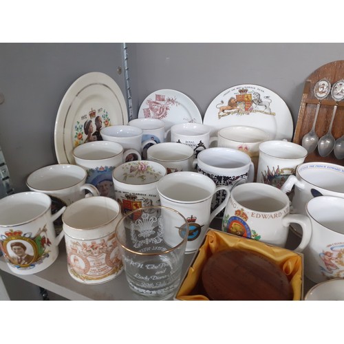 273 - A collection of commemorative china to include mugs, a Poole ER II jug, a Royal Worcester 2002 mug, ... 