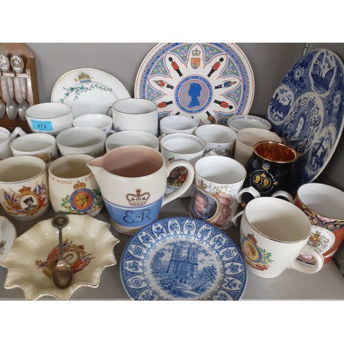 273 - A collection of commemorative china to include mugs, a Poole ER II jug, a Royal Worcester 2002 mug, ... 