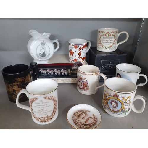 273 - A collection of commemorative china to include mugs, a Poole ER II jug, a Royal Worcester 2002 mug, ... 