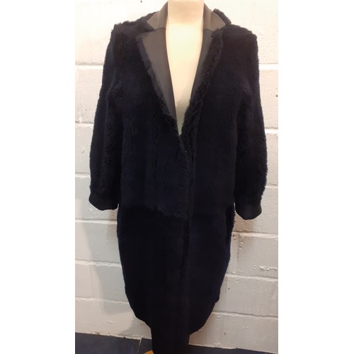 22 - Karl Donoghue-A black cashmere touch calfskin ladies reversible coat, style CMVCTW8 with front press... 