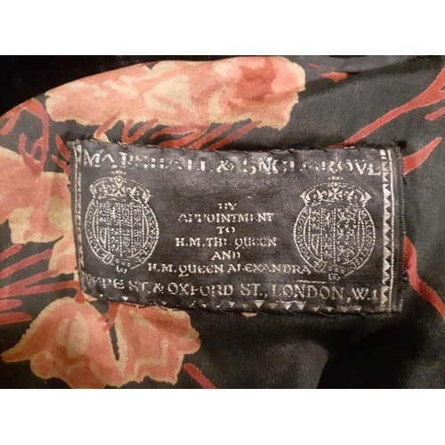 29 - An Edwardian Marshall & Snelgrove black velvet ladies evening coat with black silk lining having a r... 