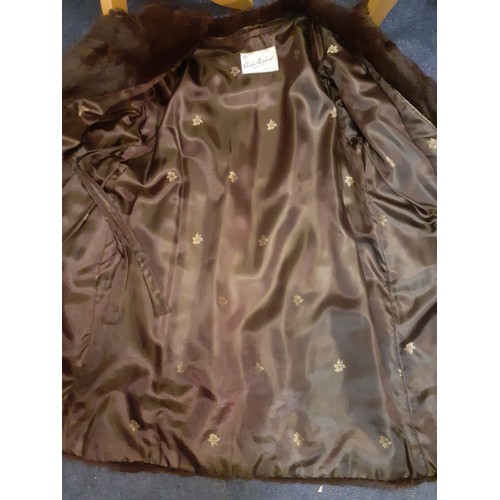 76 - A 1980's silver fox jacket, made in Malta having a vertical cut design with intermittent grey suede ... 