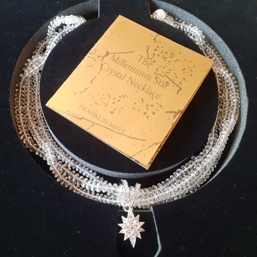 70 - A quantity of modern costume jewellery to include a boxed Franklin Mint Millenium Star crystal neckl... 