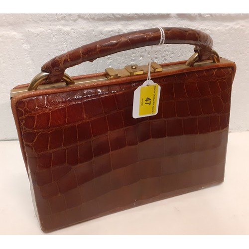 47 - A mid 20th Century brown crocodile handbag. Location: R2.2
If there is no condition report, please r... 