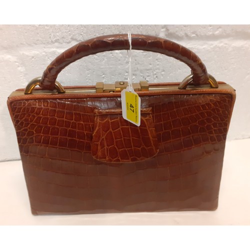 47 - A mid 20th Century brown crocodile handbag. Location: R2.2
If there is no condition report, please r... 