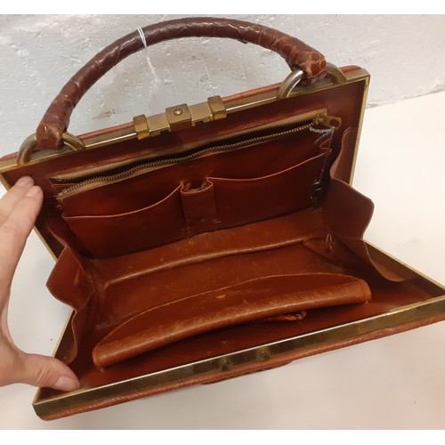 47 - A mid 20th Century brown crocodile handbag. Location: R2.2
If there is no condition report, please r... 