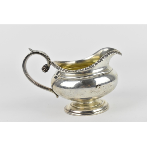 53 - A George III Scottish silver milk jug by William & Patrick Cunningham, Edinburgh 1817, with egg and ... 