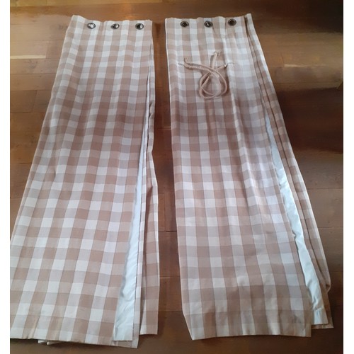 102 - A pair of full length thick cotton curtains in tan and cream check having a  black out lining and ri... 