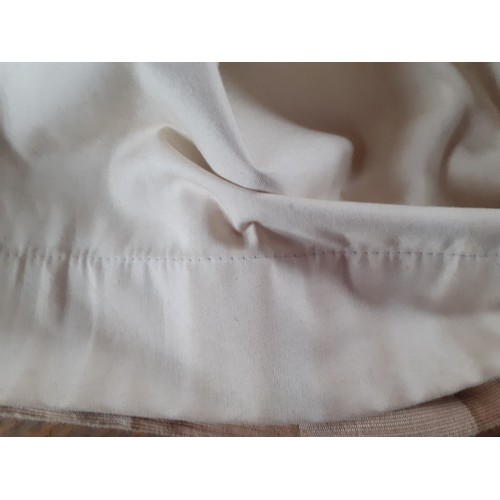 102 - A pair of full length thick cotton curtains in tan and cream check having a  black out lining and ri... 